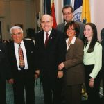 Former NYC Mayor Rudy Giuliani with family of recently deceased Congressional Medal of Honor Recipient George C. Lang; standing alongside Mayor Giuliani is Lang's brother-in-law Angelo Ciotto, WWII Marine Veteran, Battle of Iwo Jima.