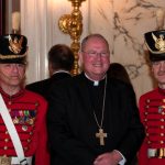 Archbishop of New York Timothy Dolon with members of the New York State Veterans Corps of Artillery Field Music Band.